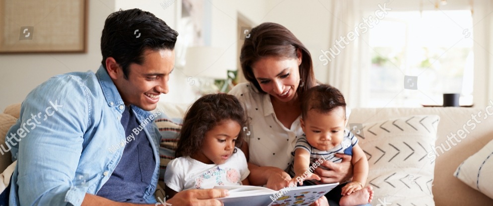 stock-photo-young-hispanic-family-of-four-sitting-on-the-sofa-reading-a-book-together-in-their-living-room-1284992743