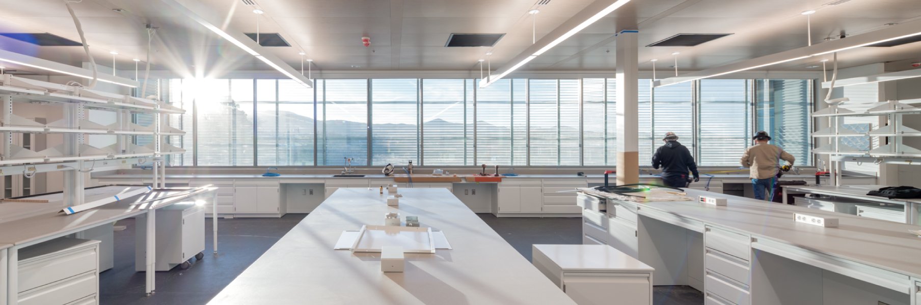 Footer_C-2 Photo of an open, sunlit forensic lab space, designed by Dekker Perich Sabatini.