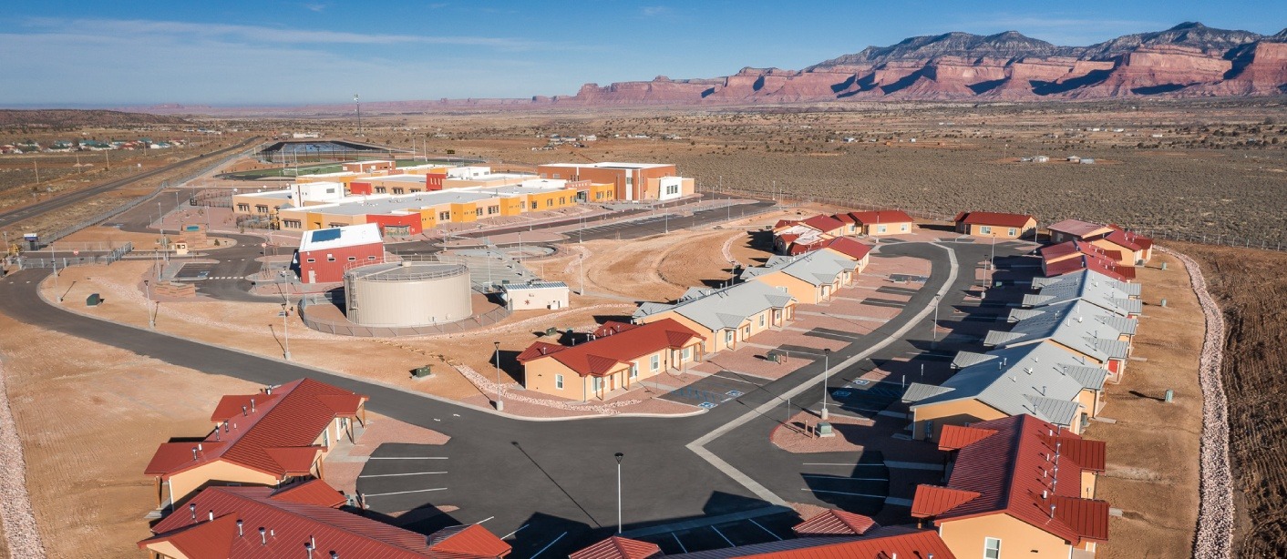 Full-Width---teacher-housing Teacher housing at Lukachukai Community School, located to one side of campus for privacy and convenience for faculty. The campus is designed for the Navajo culture, reflecting the culture and values of the Native American community it serves.
